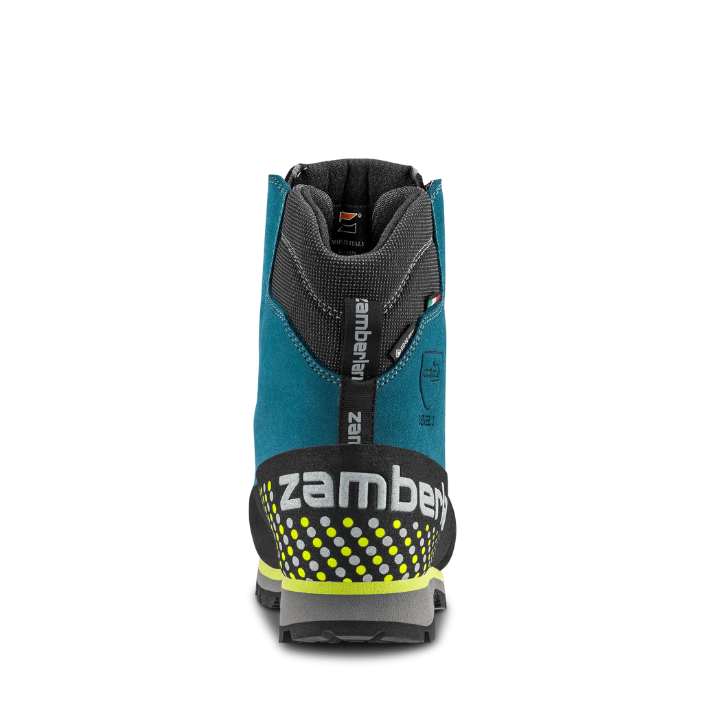 Back view of a blue and black Zamberlan ski boot on a white background