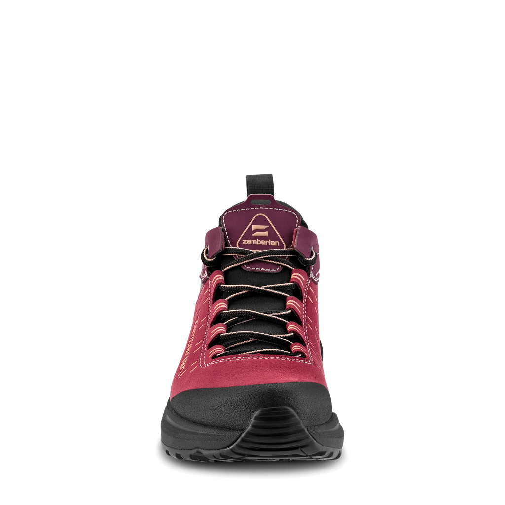 Red hiking boot with black sole on a white background