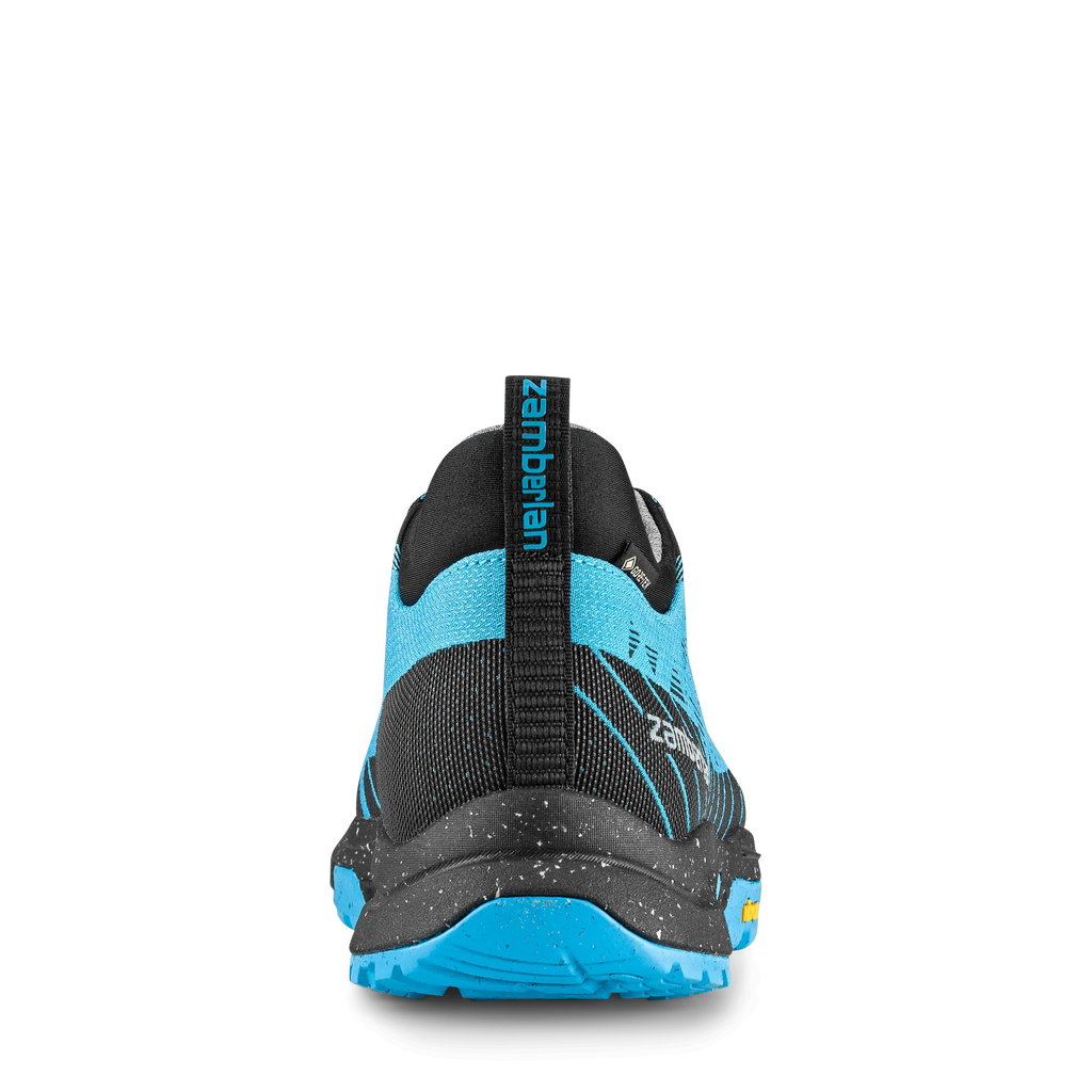 Blue and black hiking shoe with brand logo on a black background