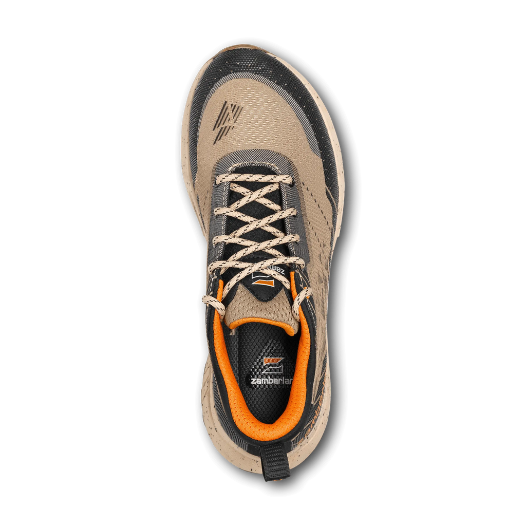 Tan and black sneaker with orange accents on a white background