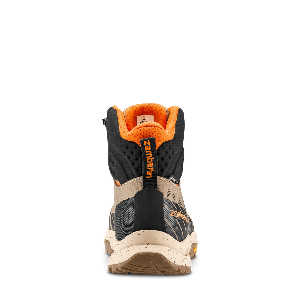 Back view of a hiking boot with orange and black design on a white background
