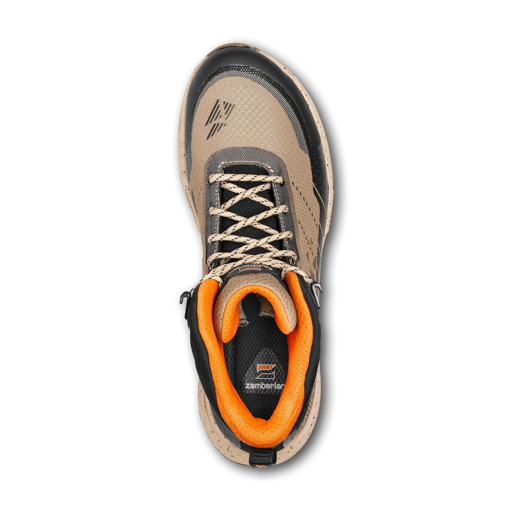 Tan and black hiking boot with orange accents on a white background