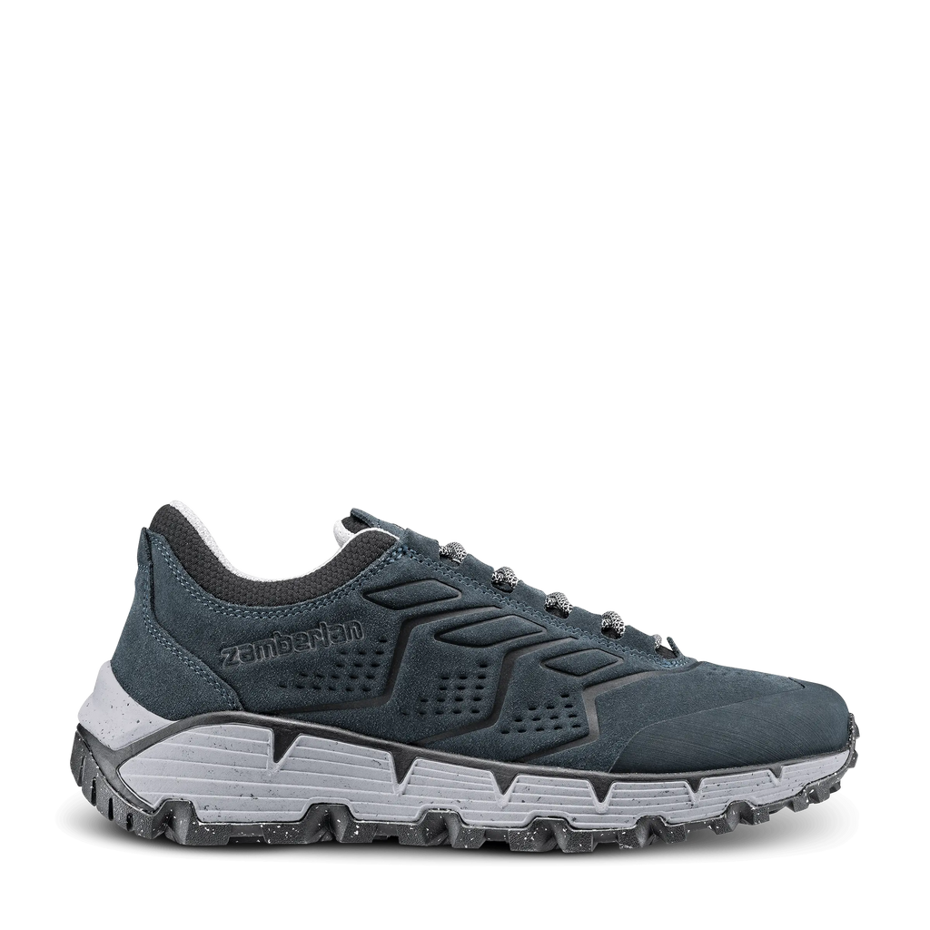 Blue athletic shoe with white sole on a black background