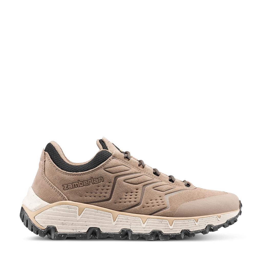 Beige sneaker with black accents on a white background