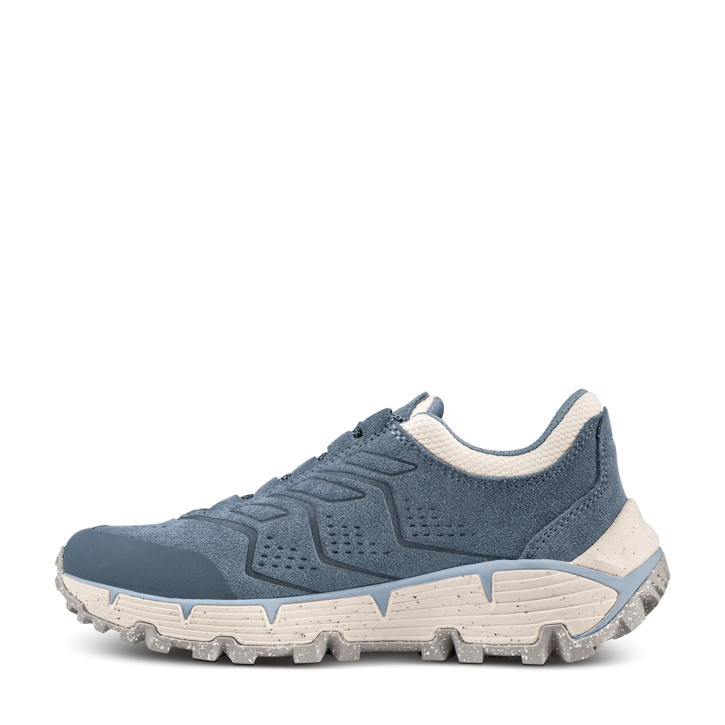 Blue athletic shoe with white sole on a black background