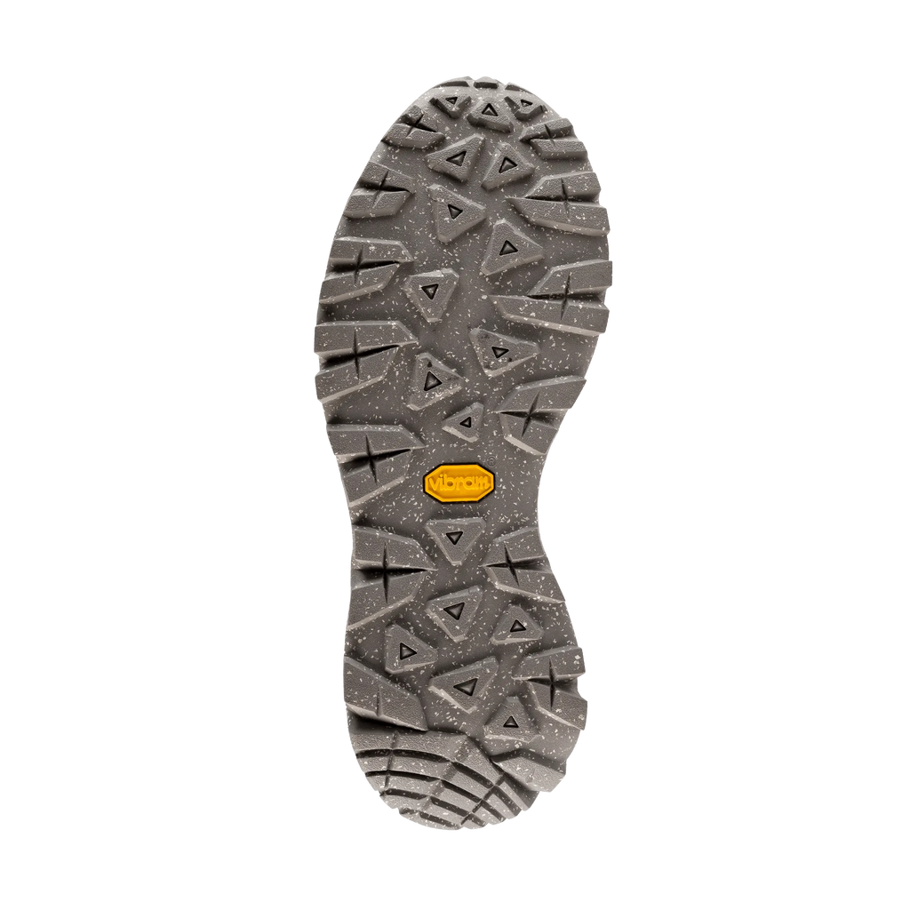Close-up of a shoe sole with tread pattern on a black background