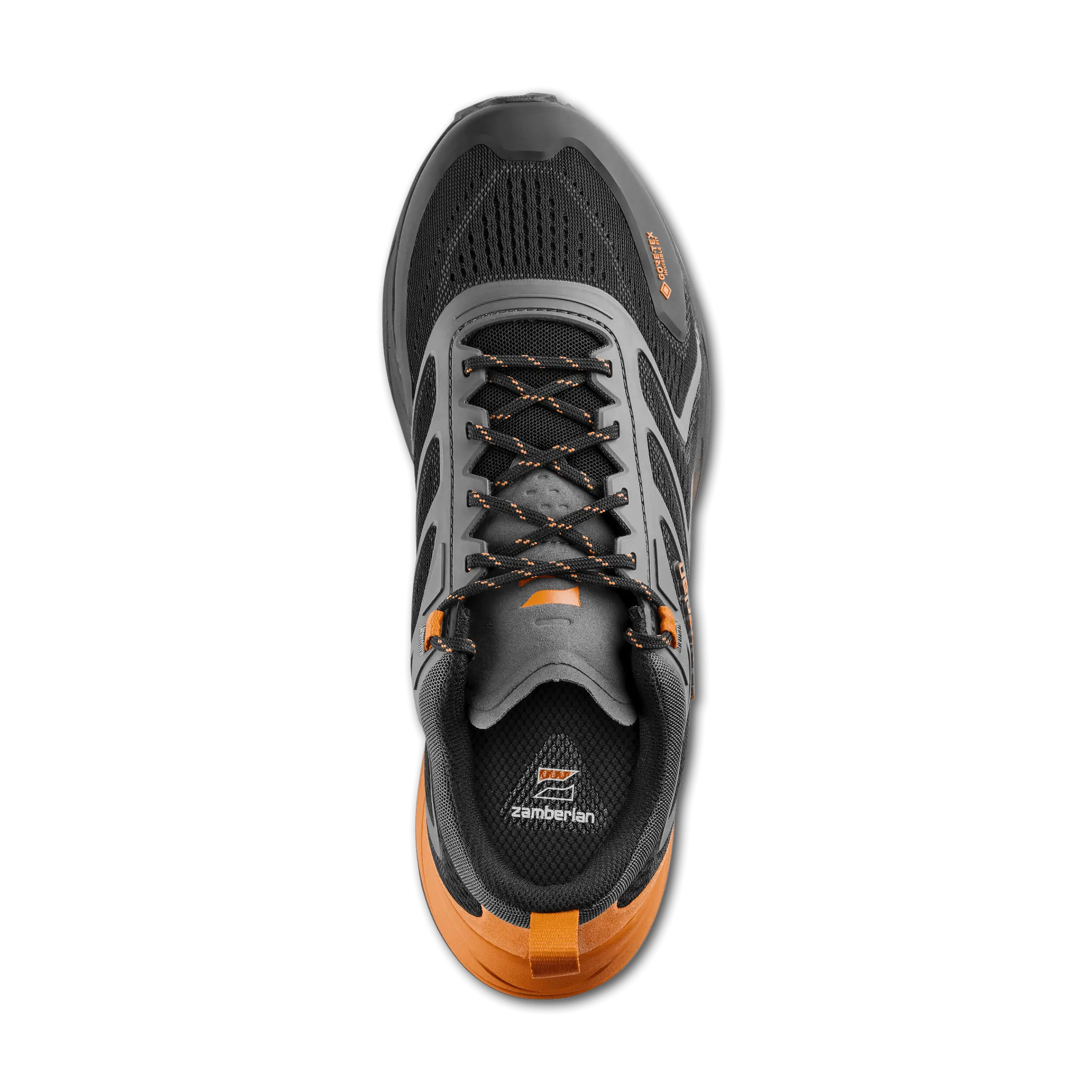 Gray and orange athletic shoe on a black background