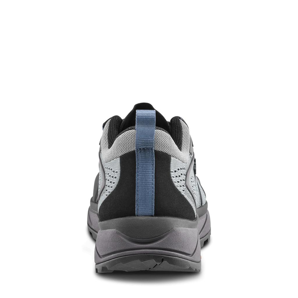 Back view of a gray and black athletic shoe with a blue strap on a black background