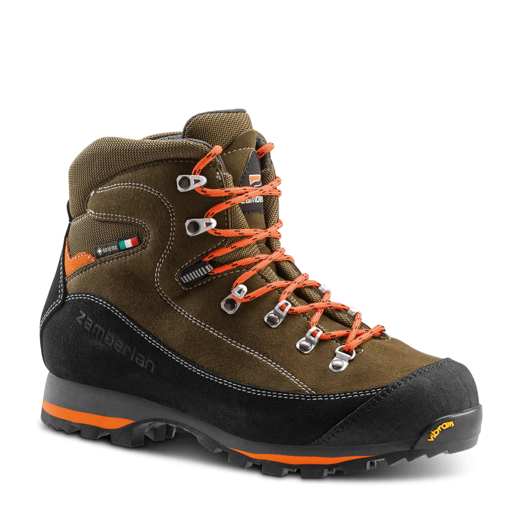 Brown hiking boot with orange laces on a black background
