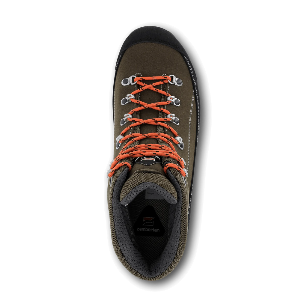 Hiking shoe with orange laces on a black background