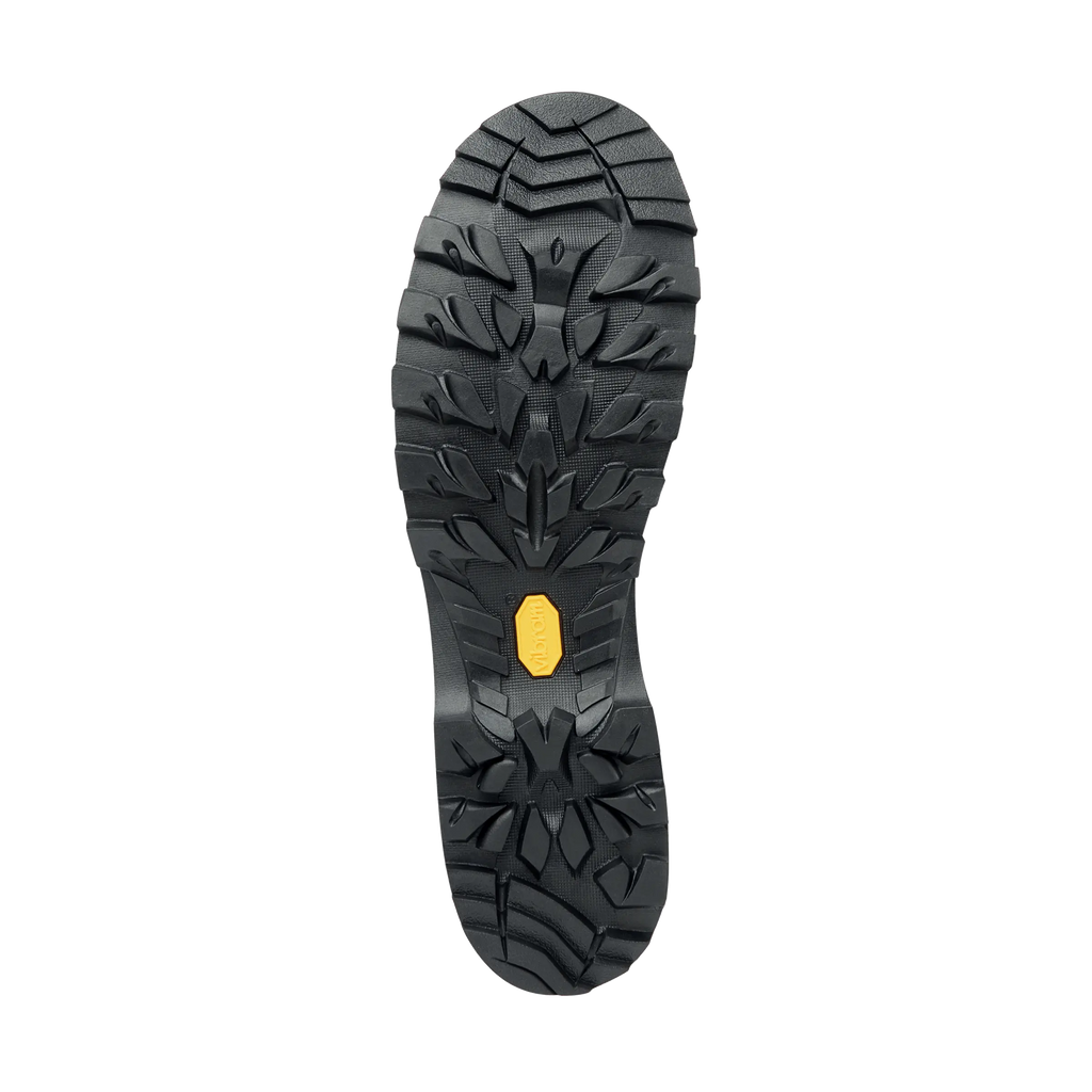 Black sole of a shoe with a yellow heel tab on a white background