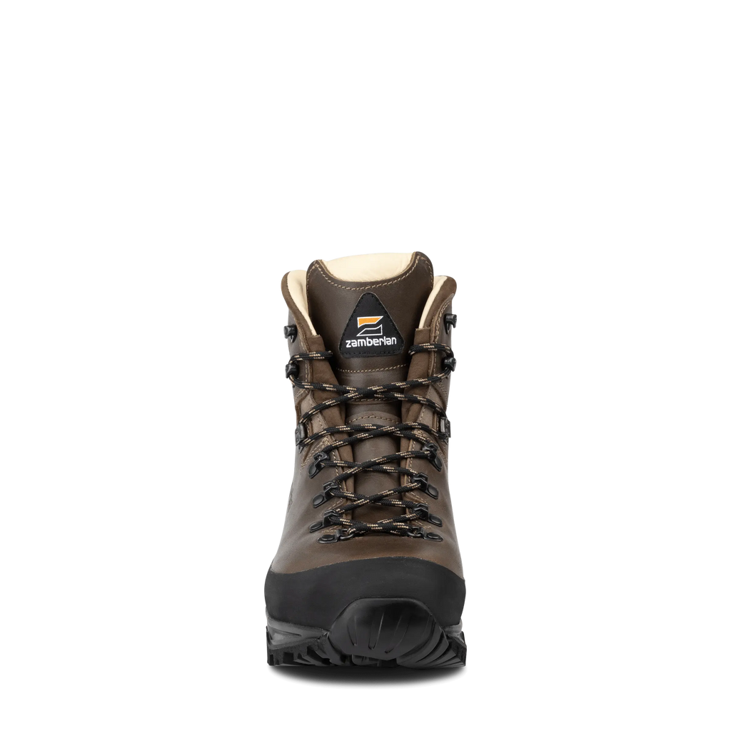 Brown hiking boot with black sole on a white background