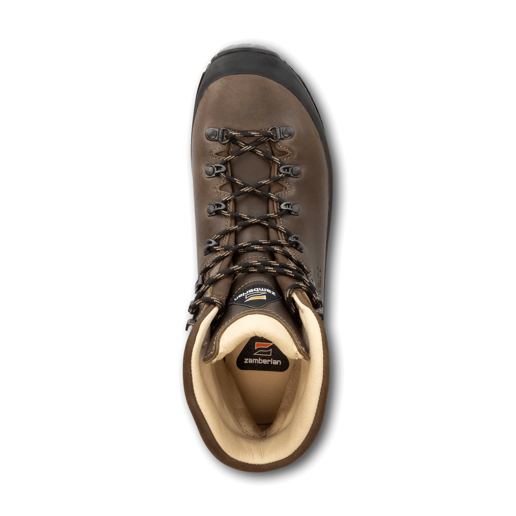 Brown hiking boot with visible brand logo on a black background
