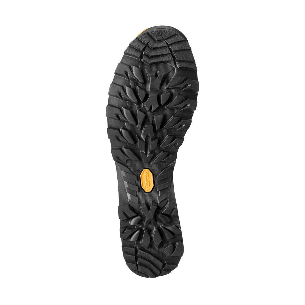 Close-up of a black shoe sole with a yellow label on a white background
