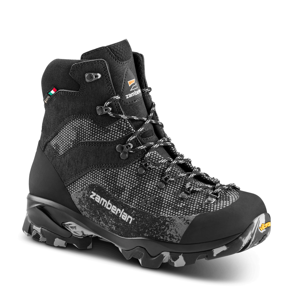 Black hiking boot with visible Zamberlan branding on a black background
