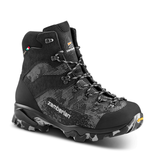 Black hiking boot with visible Zamberlan branding on a black background