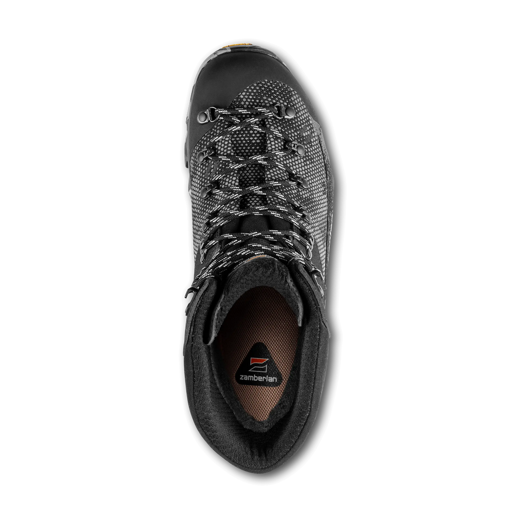 Black hiking boot with brand logo on a black background