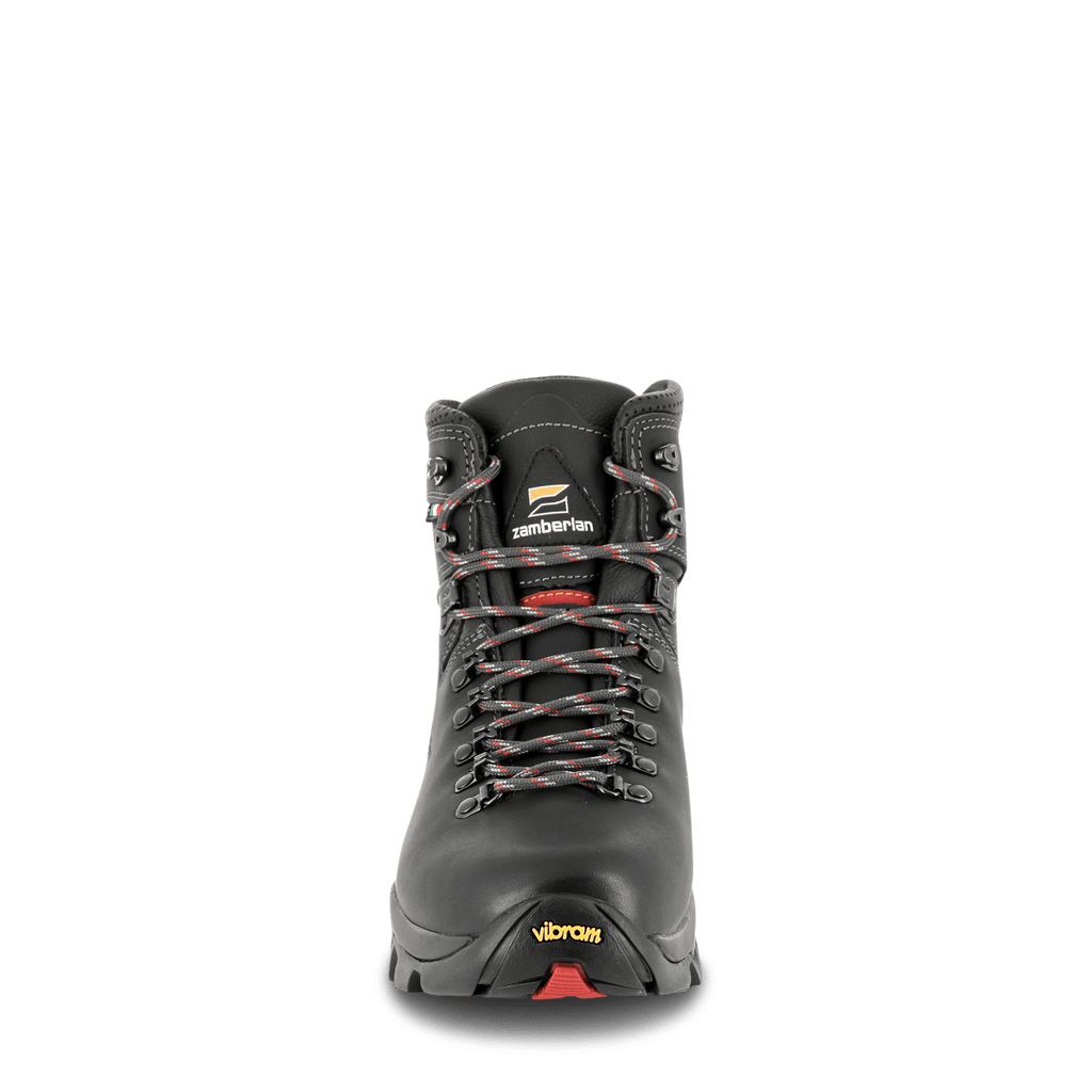 Gray hiking boot with visible brand logos on a black background