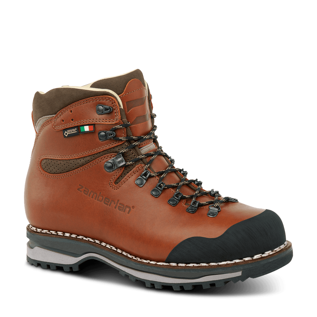 Brown hiking boot with black sole on a white background