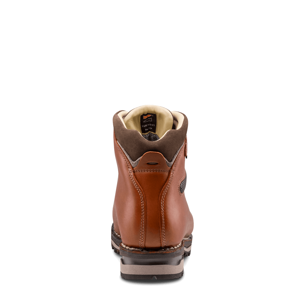Brown leather boot with beige lining on a black background