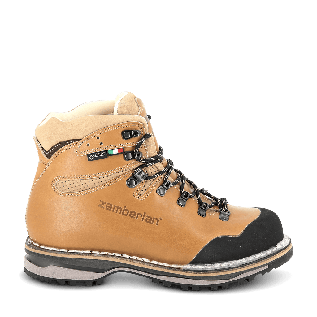 Tan hiking boot with black accents on a white background