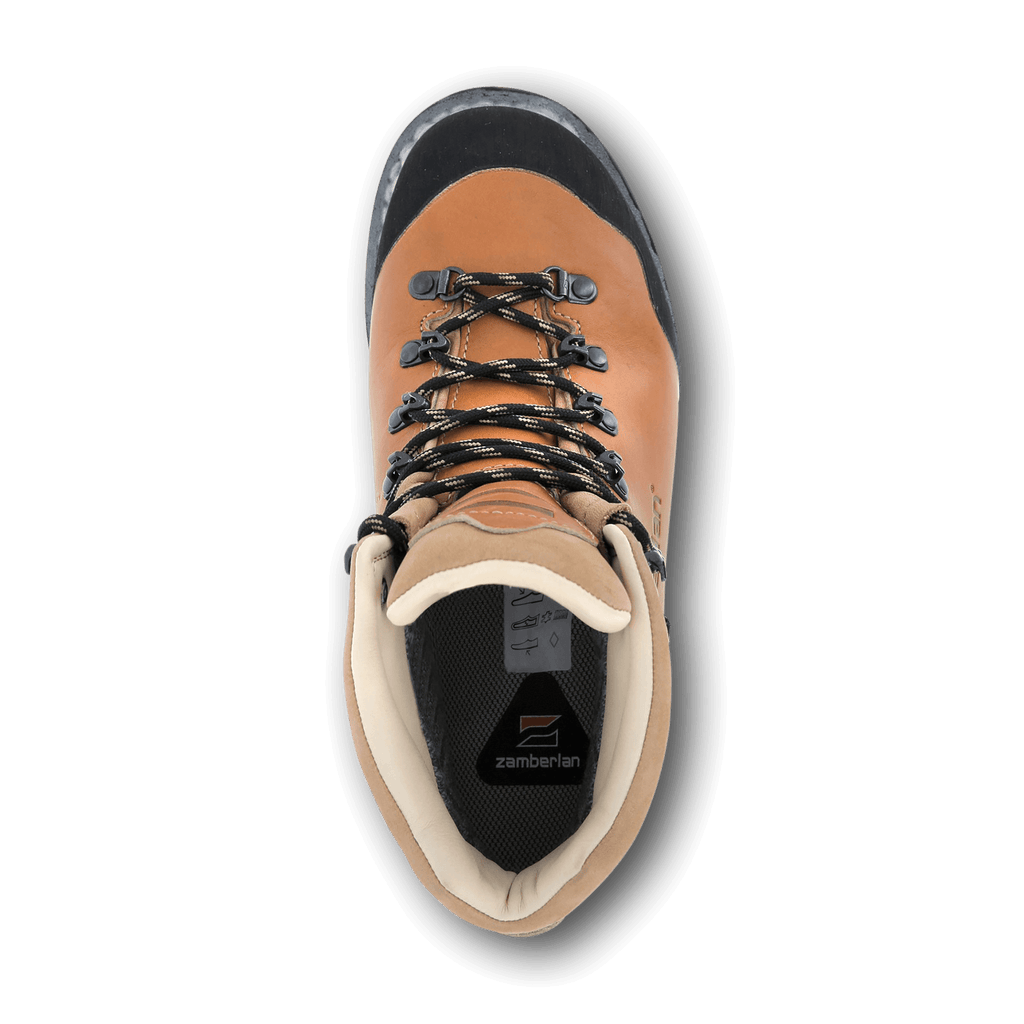 Tan hiking boot with black laces on a white background