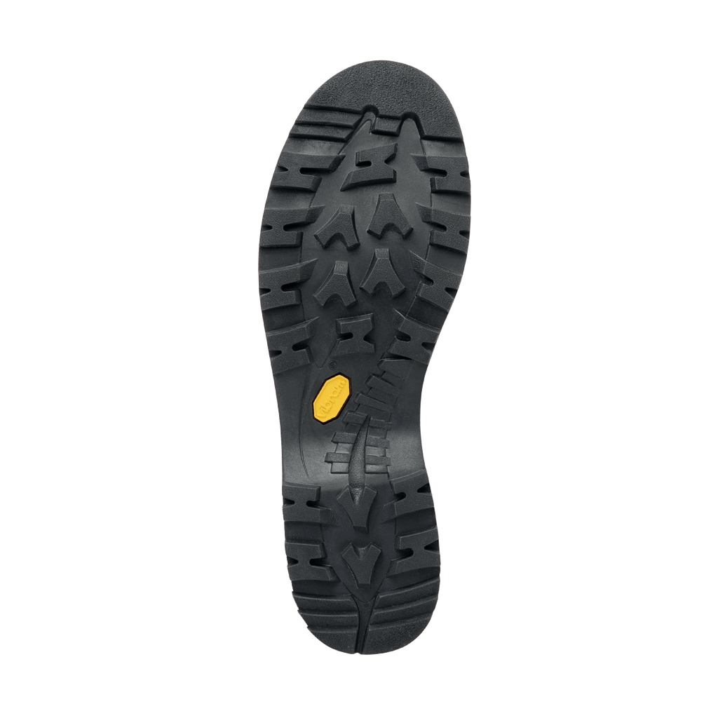 Black sole of a shoe with a yellow dot on a white background