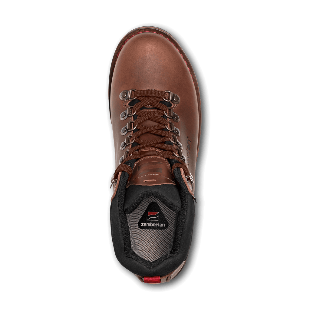 Brown hiking boot with visible brand logo on a black background