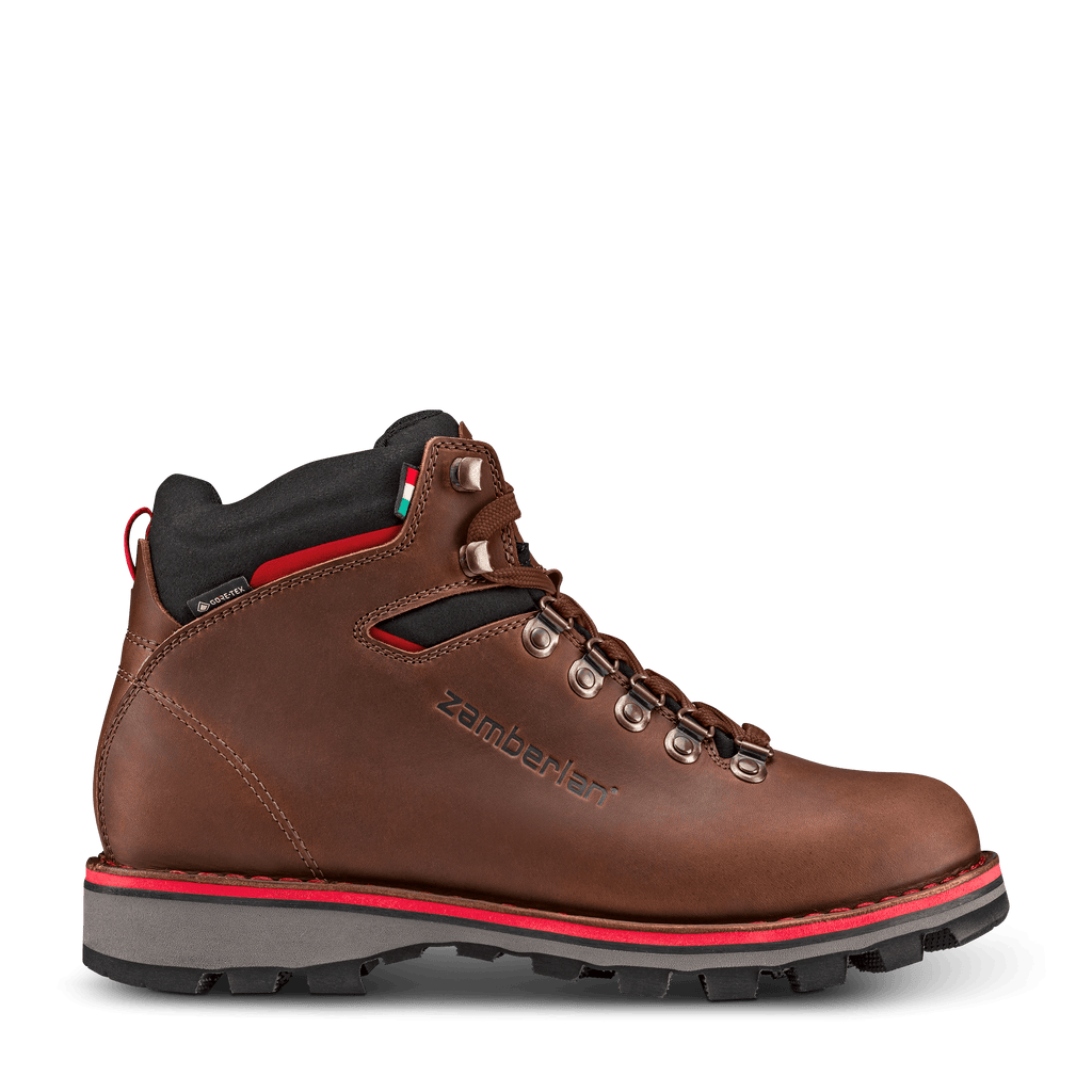 Brown hiking boot with brown laces on a white background