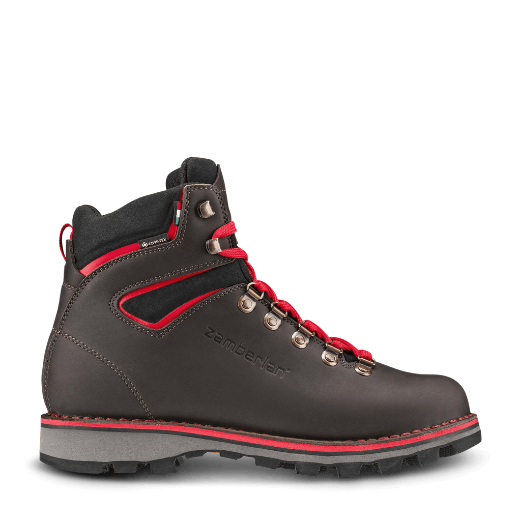 Black hiking boot with red accents on a white background