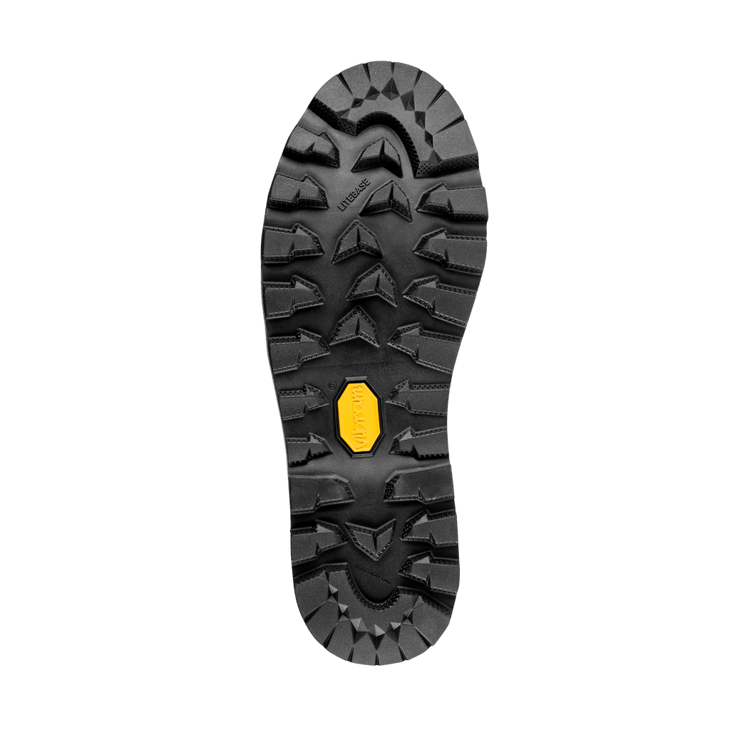 Close-up of a black shoe sole with a yellow brand logo on a black background