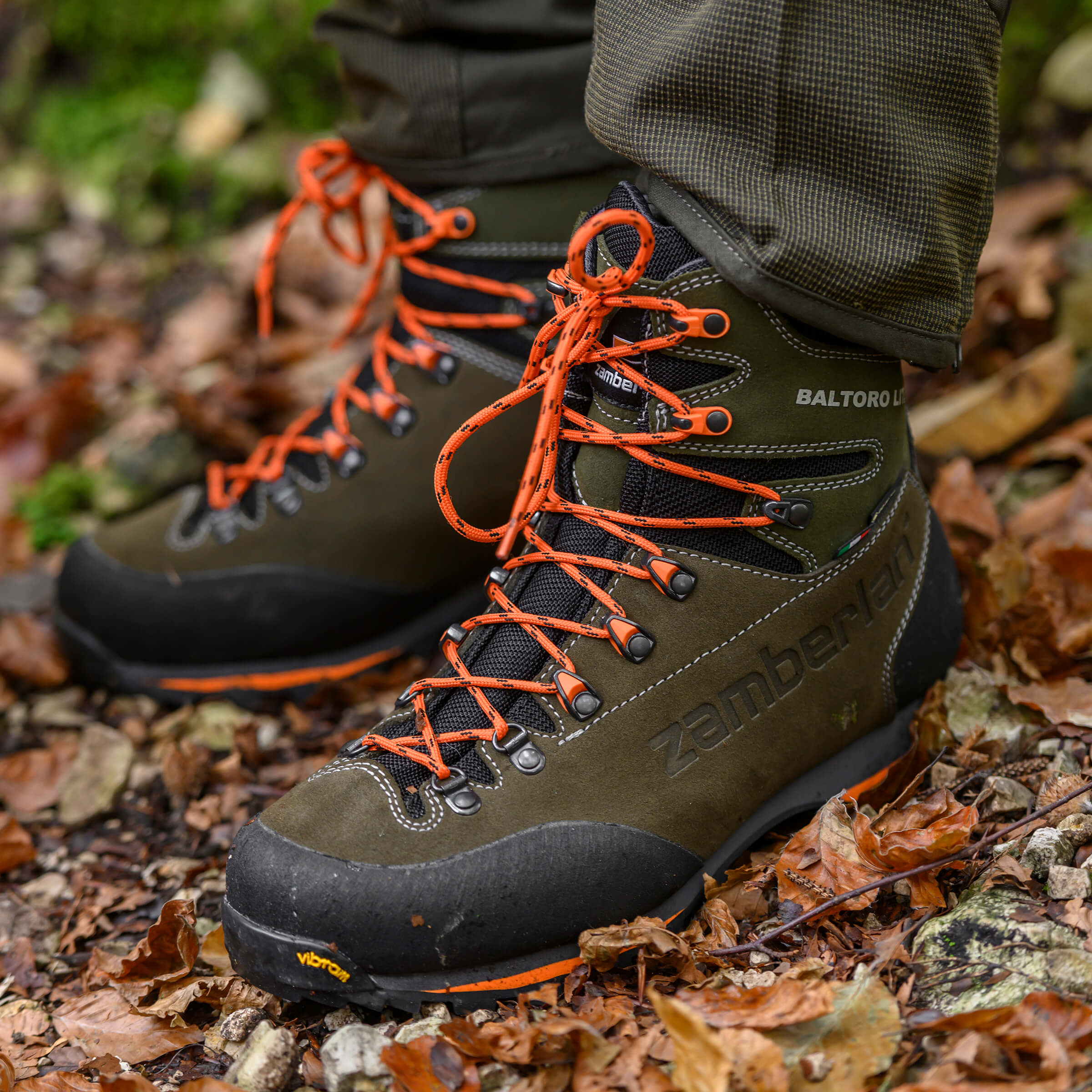 hunters wearing a pair of green boots