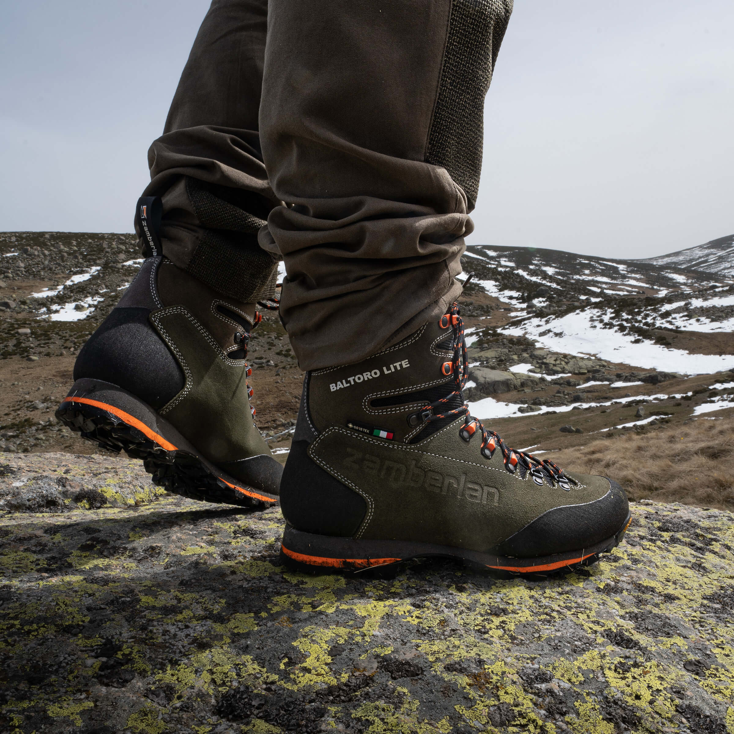 hunters wearing a pair of green boots
