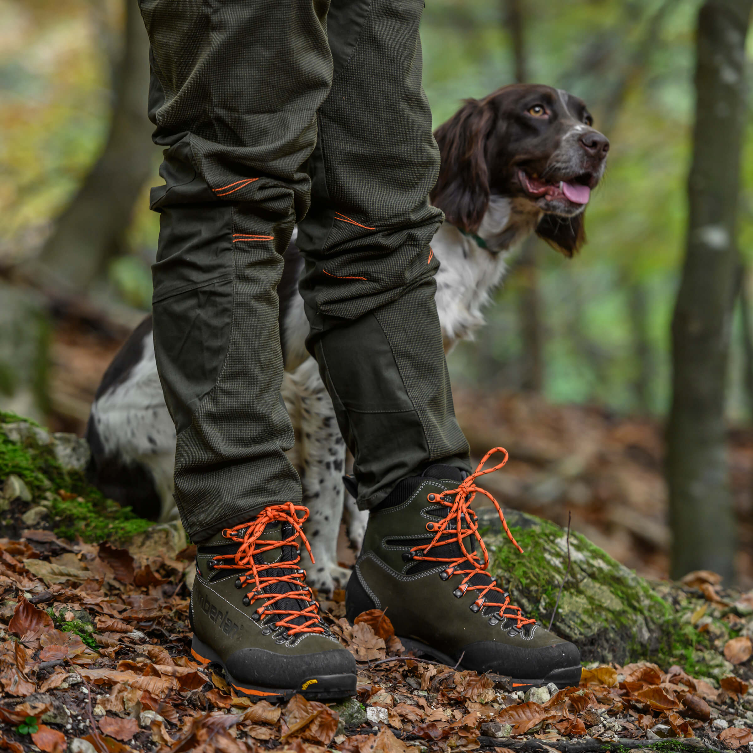 hunters wearing a pair of green boots
