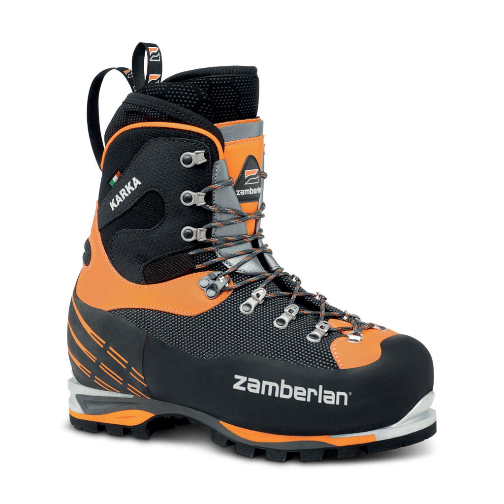 Black and orange hiking boot with visible Zamberlan branding on a black background