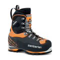 Black and orange hiking boot with visible Zamberlan branding on a black background